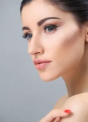 young woman posing with make up on